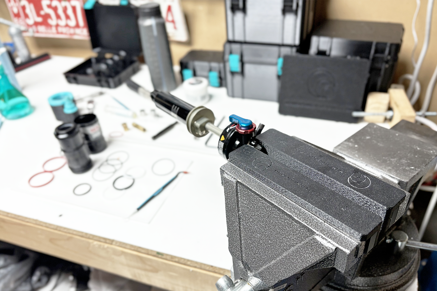 Soft Vise Jaw Pads - PRO holding an MTB shock during a 50-hour maintenance service, protecting the surface while ensuring a secure grip for precise suspension work.
